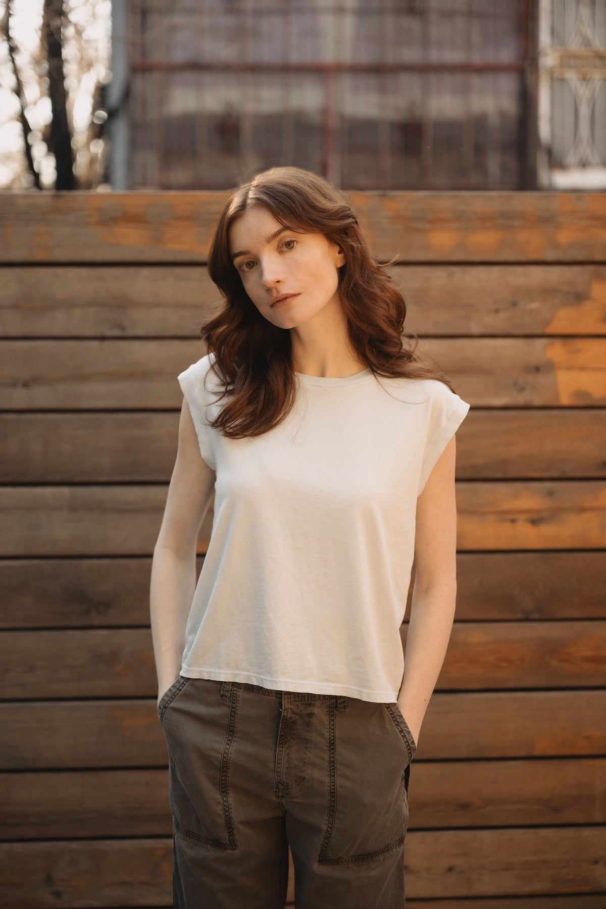 White sleeveless muscle tee with crew neck, front view