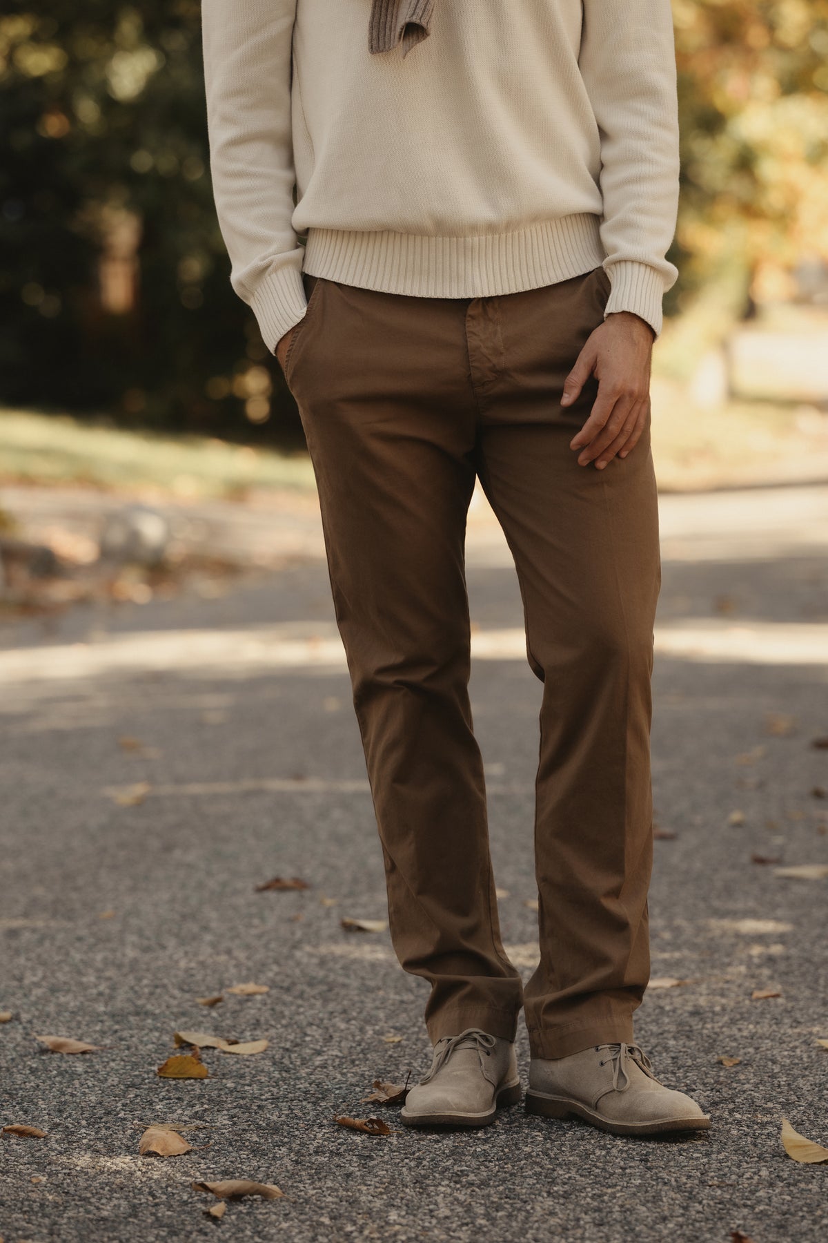 Dark brown twill chino pants with belt loops, zip fly, and front pockets