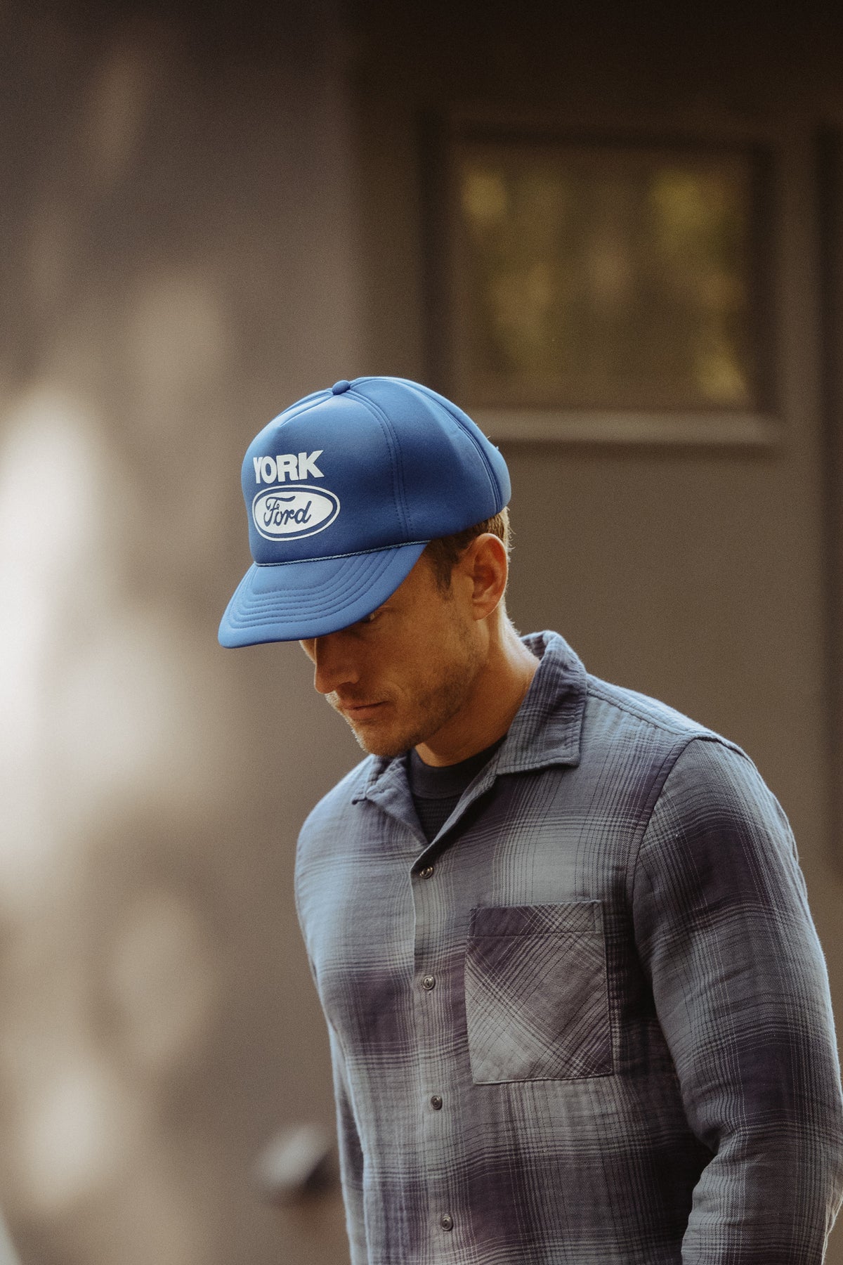 Blue baseball cap with YORK Ford logo, side profile and curved brim