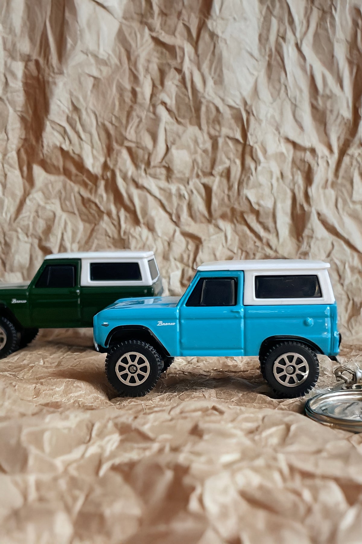 Blue and green 1966 Bronco diecast keychains with metal keyring