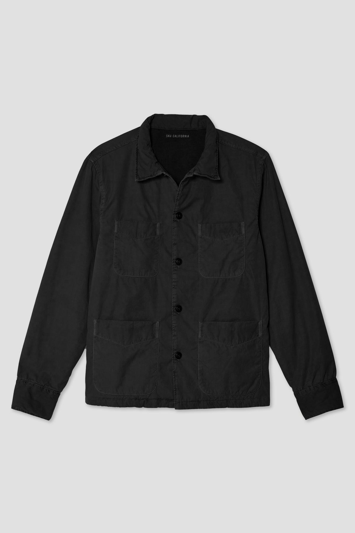 Black camp shirt jacket with button front, pointed collar, and chest flap pockets