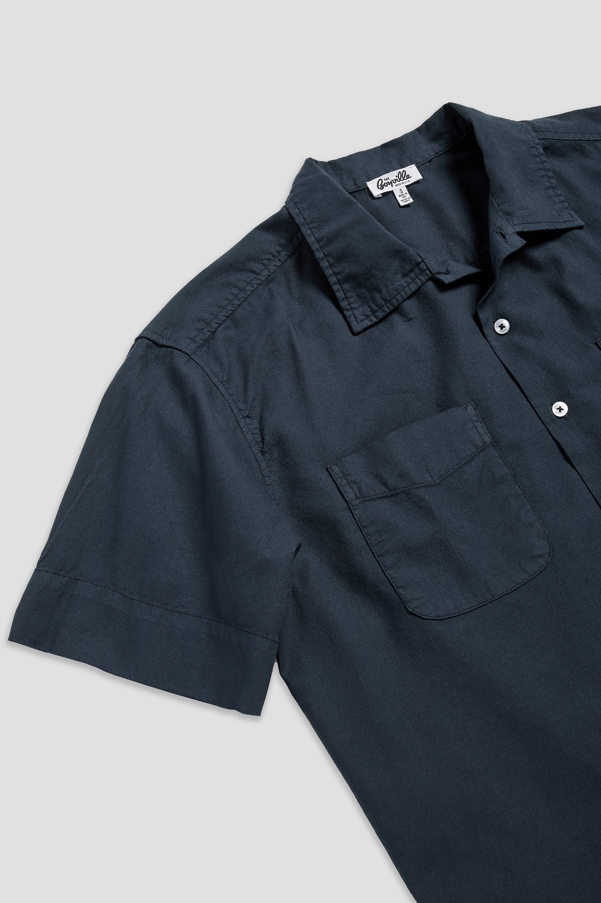 Navy oxford shirt close-up, short sleeves with chest pocket and button placket