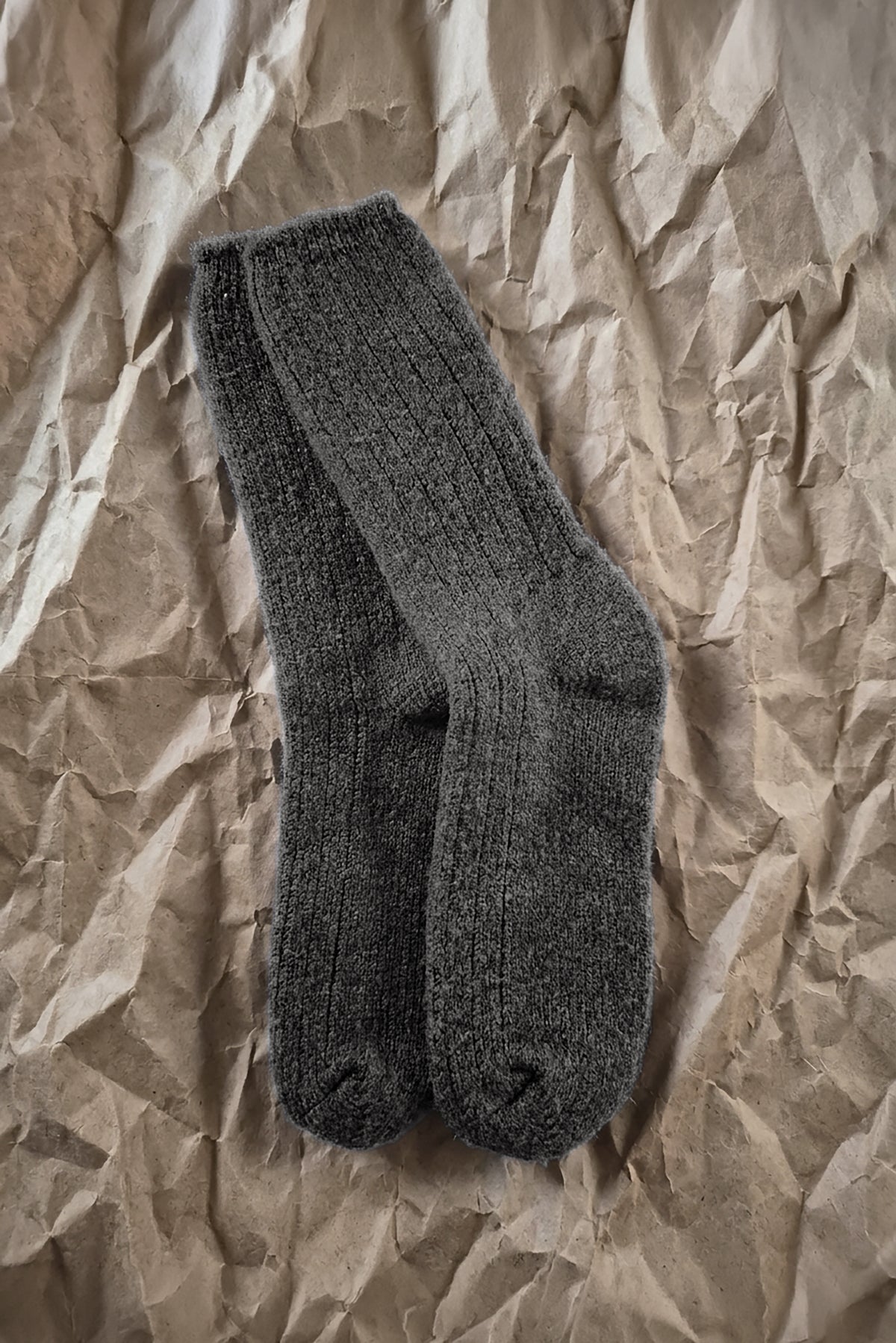 Dark gray merino crew socks with ribbed cuffs and knit texture