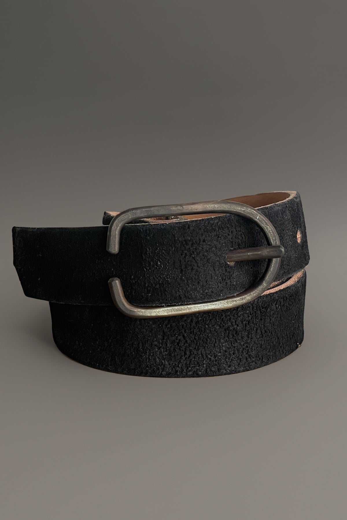 Black distressed leather belt with oval silver buckle