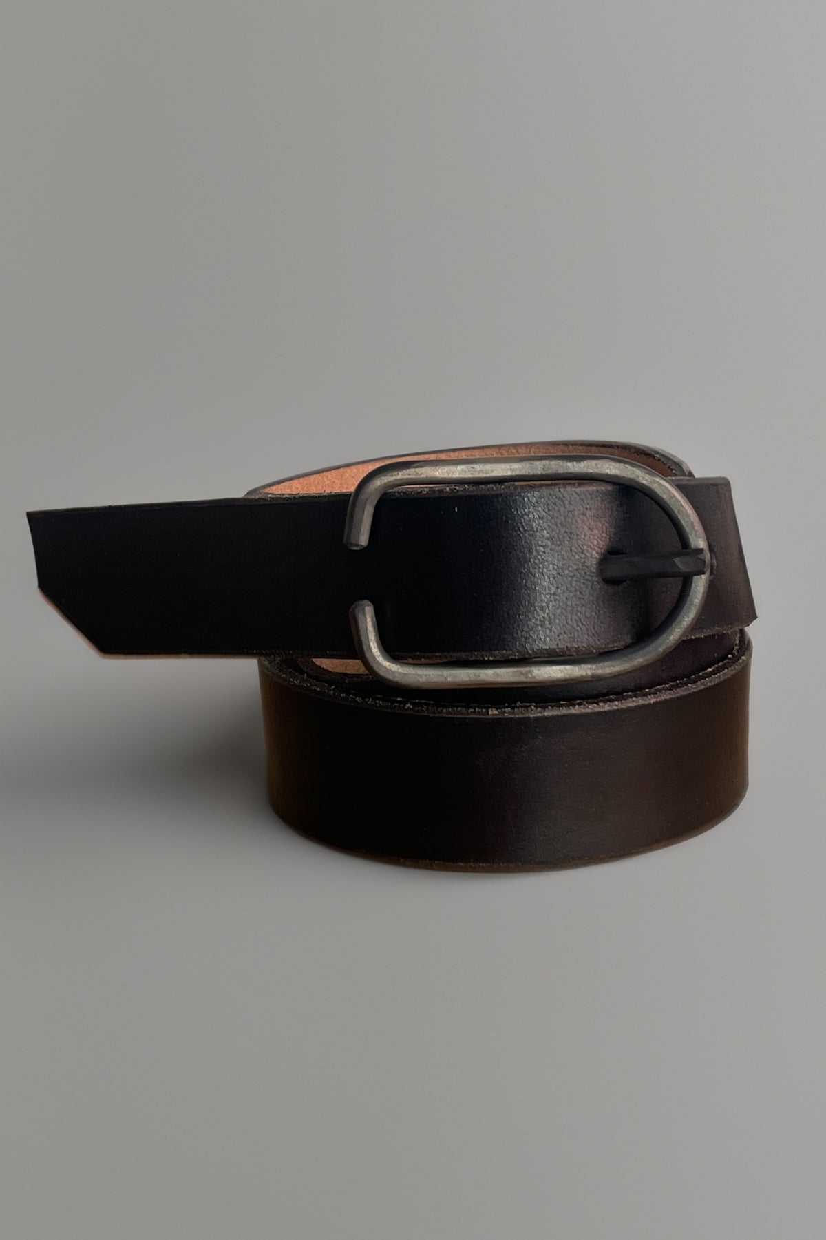 Black leather belt with oval silver buckle