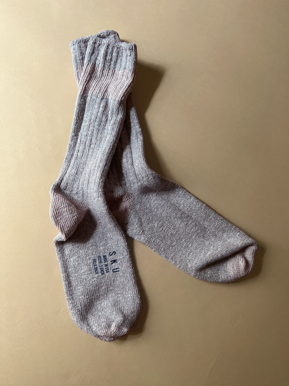 Heather grey crew socks with darker heel, toe, and contrast band at foot